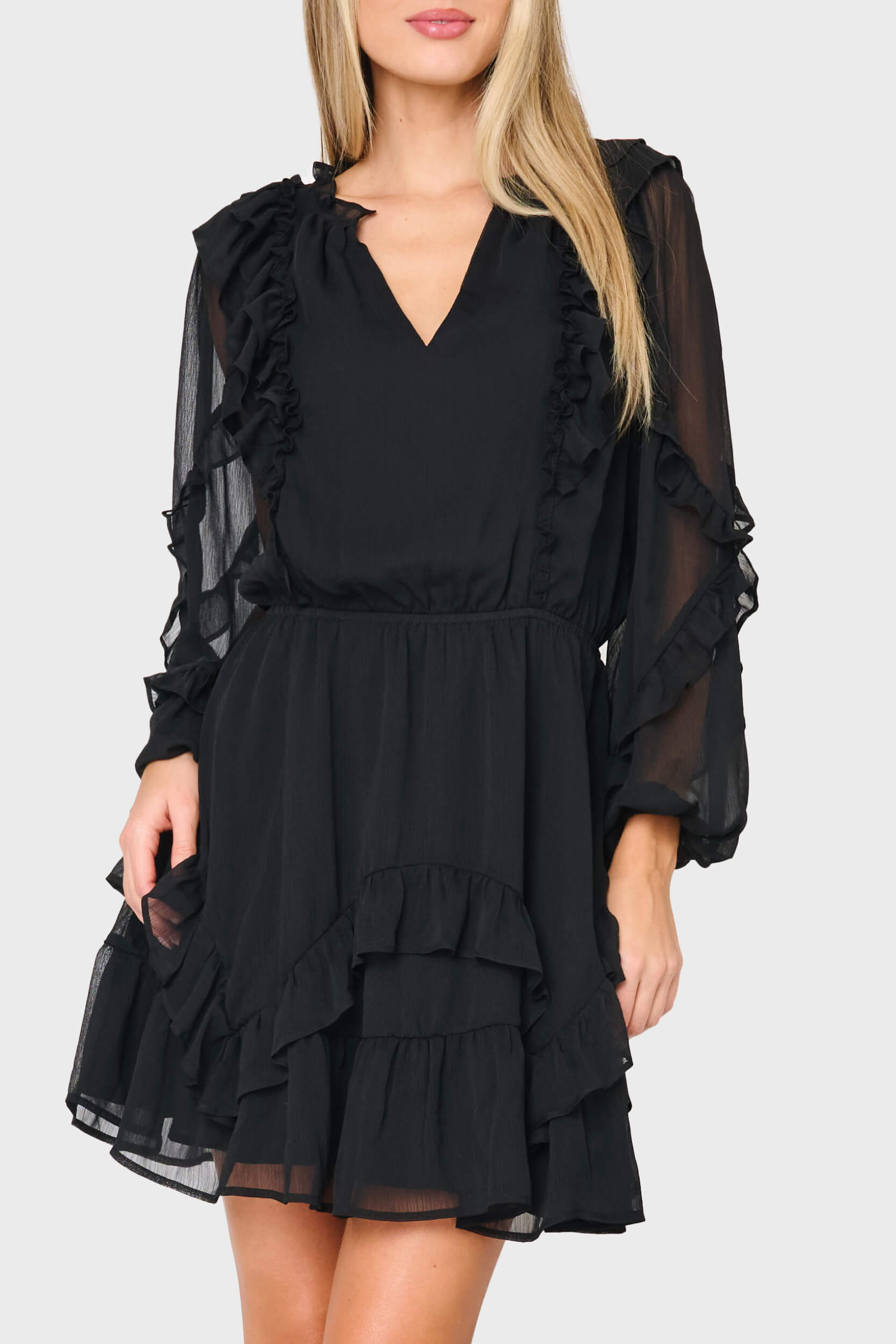 Woman modeling Chloe Ruffles For Days Dress in Black styled business casual