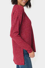The Side of a Woman wearing a V-Neck Shimmer Tunic with High Low Hem Burgundy