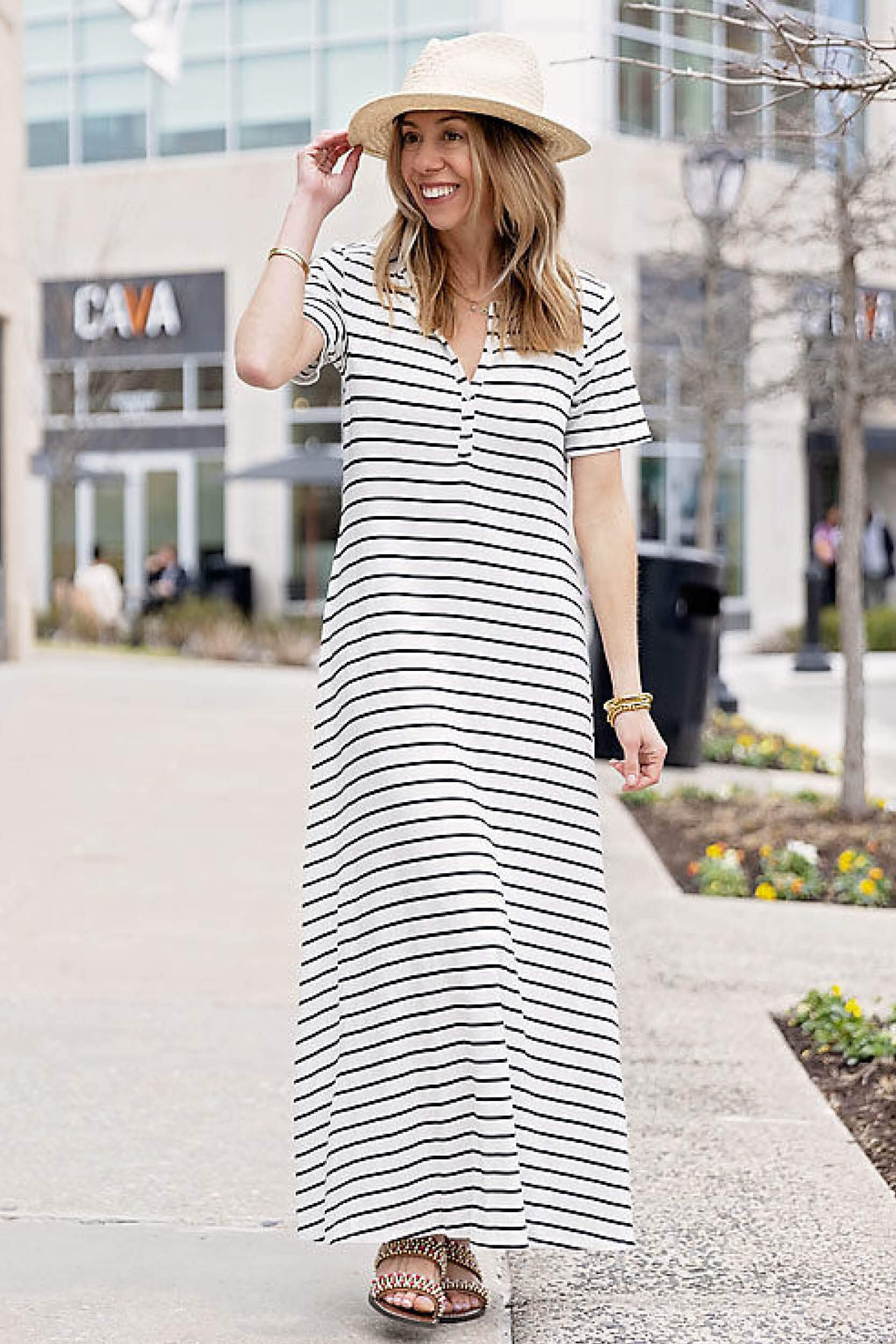 Front of Woman wearing Black Ivory Stripe Henley Detail Knit Maxi Dress