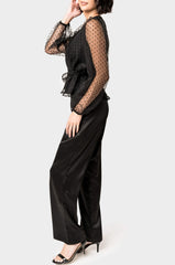 Side of Woman wearing Surplice Wrap Top with Organza Dot Sleeve in Black