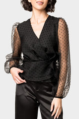 Front of Woman wearing Surplice Wrap Top with Organza Dot Sleeve in Black