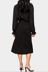 Back of Woman wearing Wrapped Up Skirt with Buckle in Black
