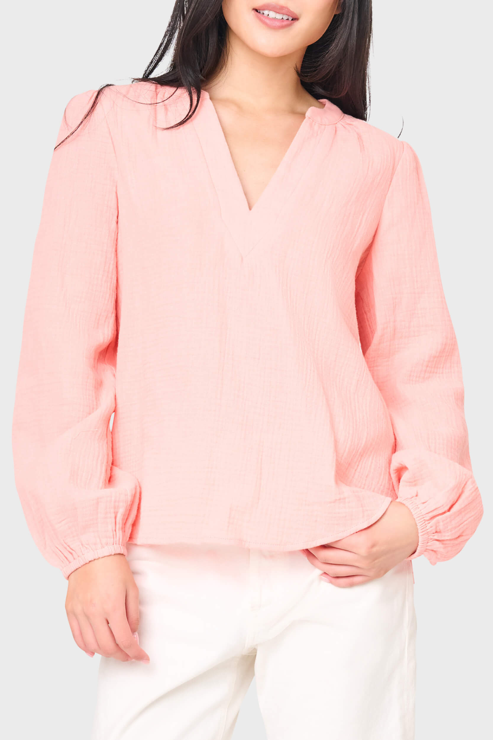 Woman modeling Meadow Bracelet Sleeve V-Neck Gauze Top in peach pink styled for everyday 