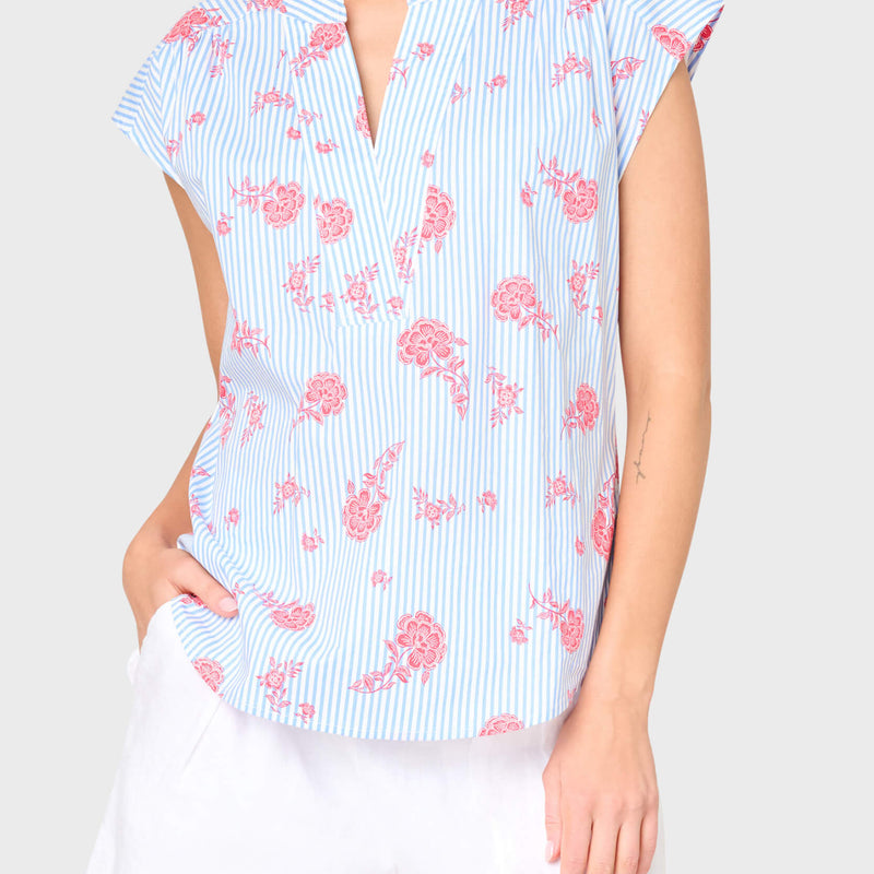 Woman modeling Cap Sleeve Notch Neck Blouse in blue stripe red floral print. Styled for vacation, weekends, and everyday