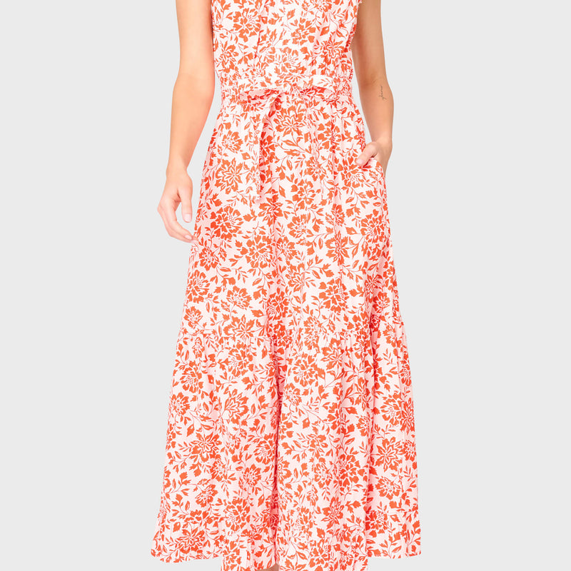 Woman modeling Notch Neck Flutter Sleeve Maxi Dress in Blossom Haze coral floral styled for work and everyday