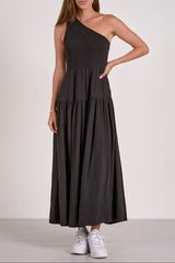 Woman wearing a black one-shoulder dress on a white background
