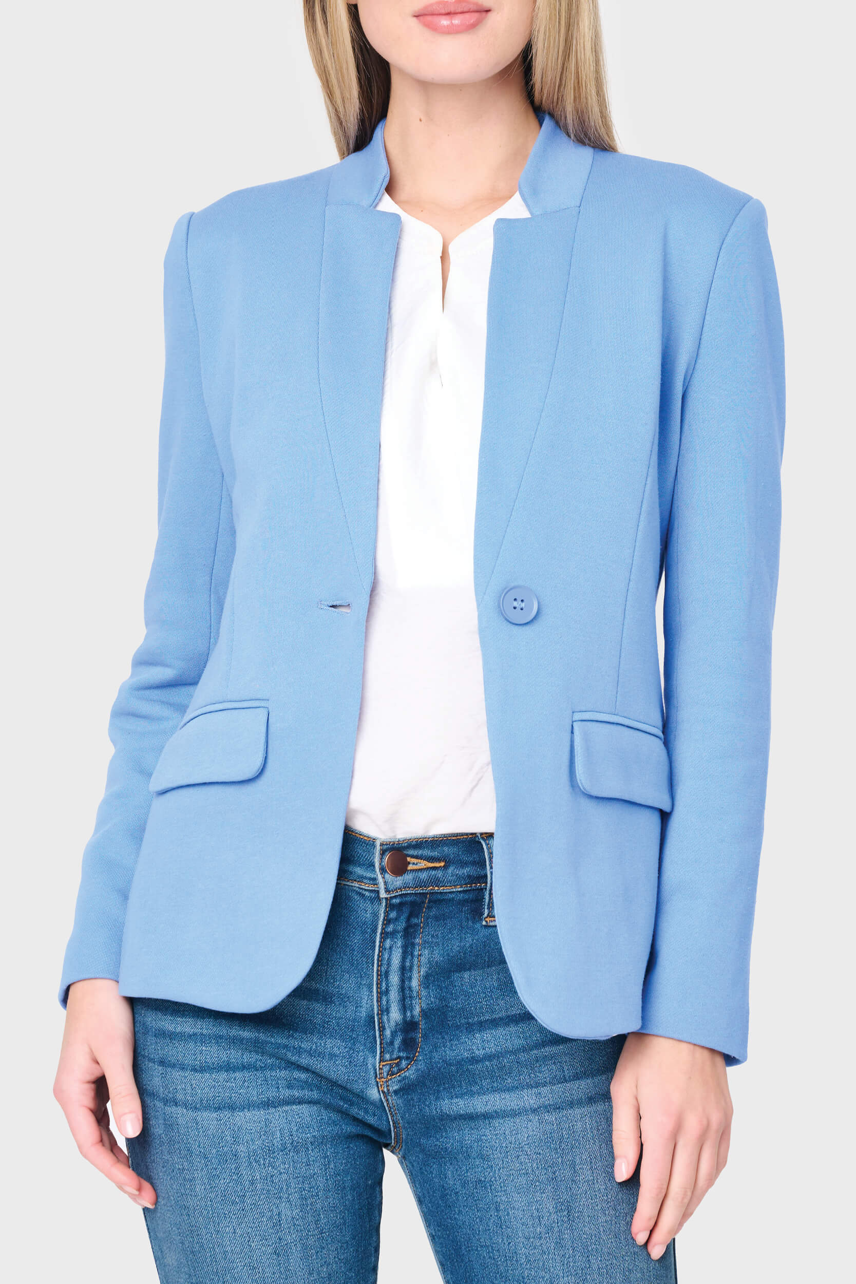 Light blue blazer worn by a person on a white background