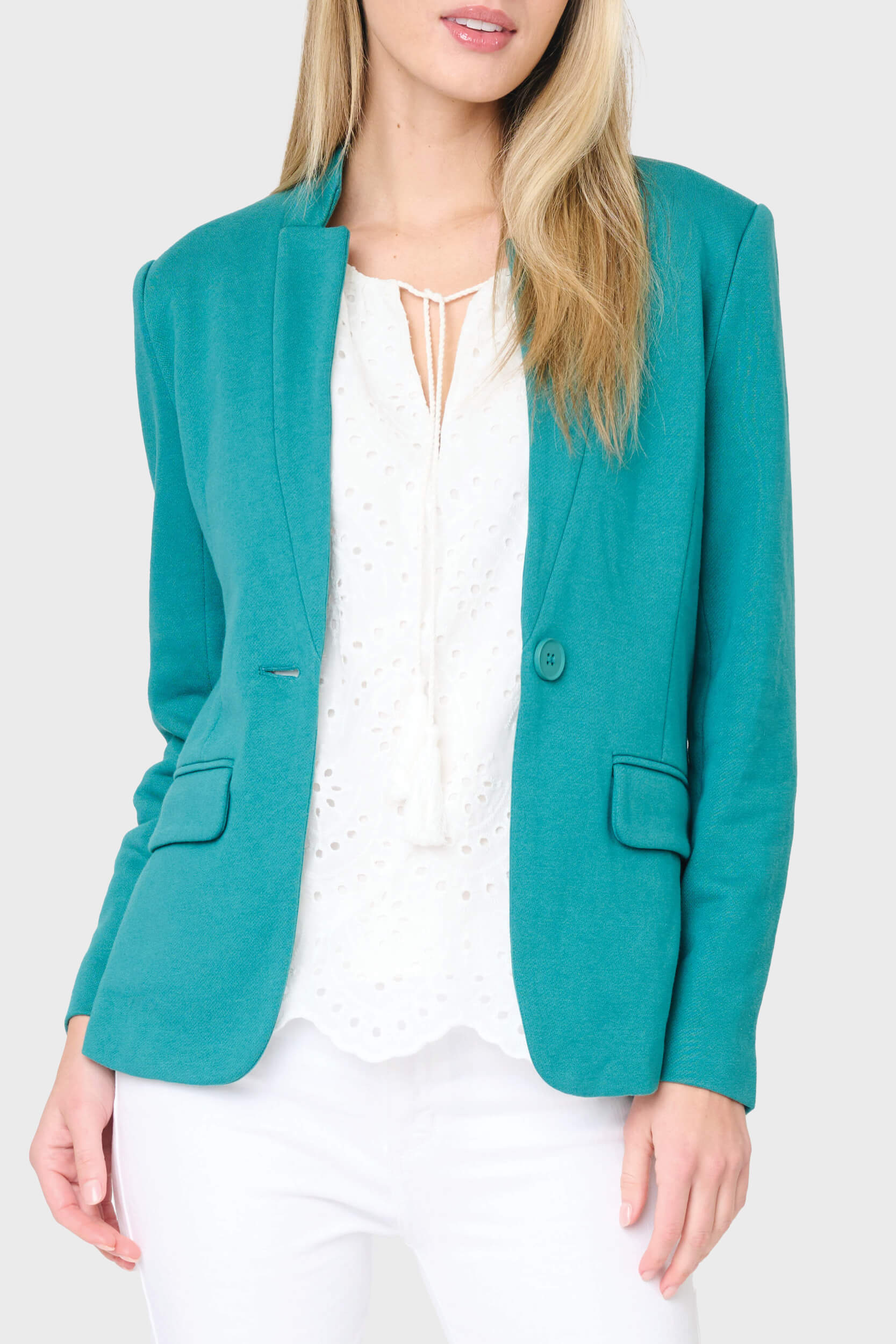Woman modeling Notch Collar knit blazer in teal styled for work to weekend