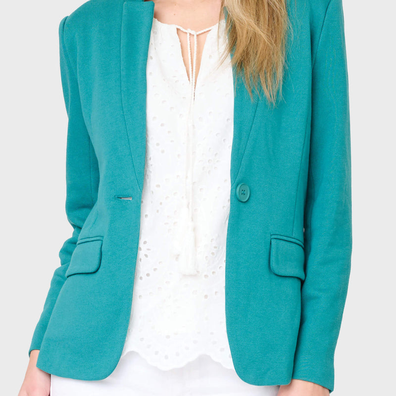 Woman modeling Notch Collar knit blazer in teal styled for work to weekend