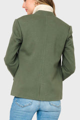 Green jacket worn by a person on a white background