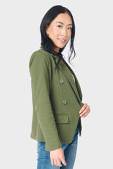 Side of women wearing double breasted blazer in green