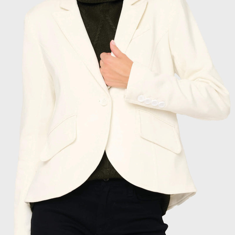Woman modeling Notch Lapel Stretch Knit Blazer in Ivory styled business casual for work