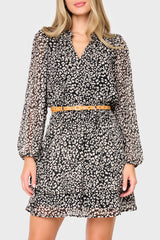 Woman modeling Long Sleeve Isla Smocked Day Dress in Black Cheetah Print  styled for weekend date night