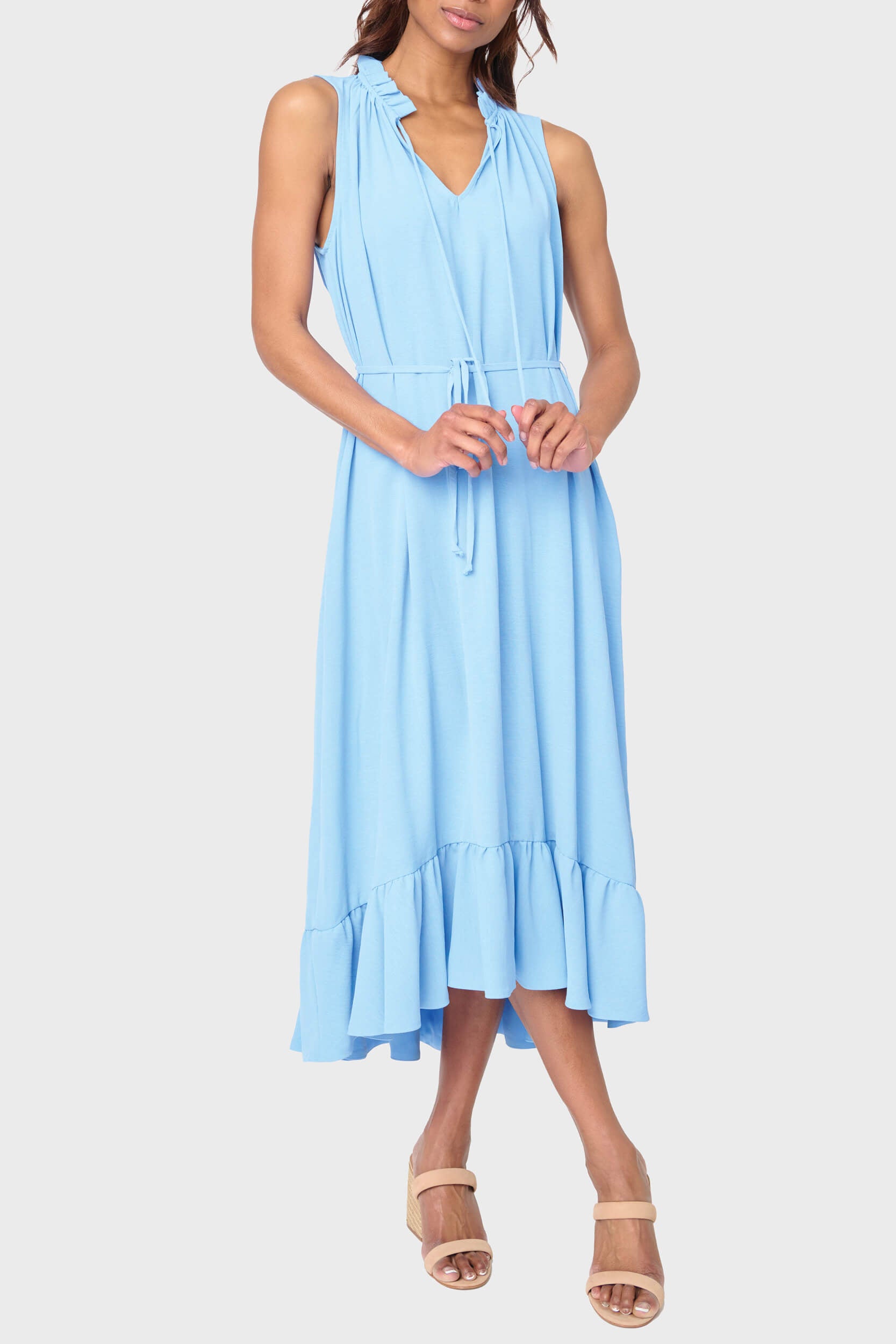 Woman modeling Sienna Sleeveless Tie Neck Midi Dress in sky blue styled for work and weekends