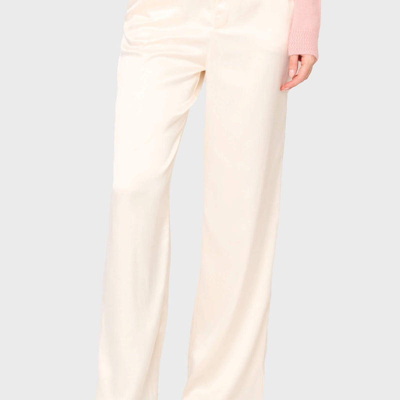 Woman modeling Stovepipe Satin Trouser in Ivory Champagne, styled business casual for holiday parties