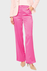 Woman modeling Stovepipe Satin Trouser in Fuchsia pink styled business casual for holiday parties