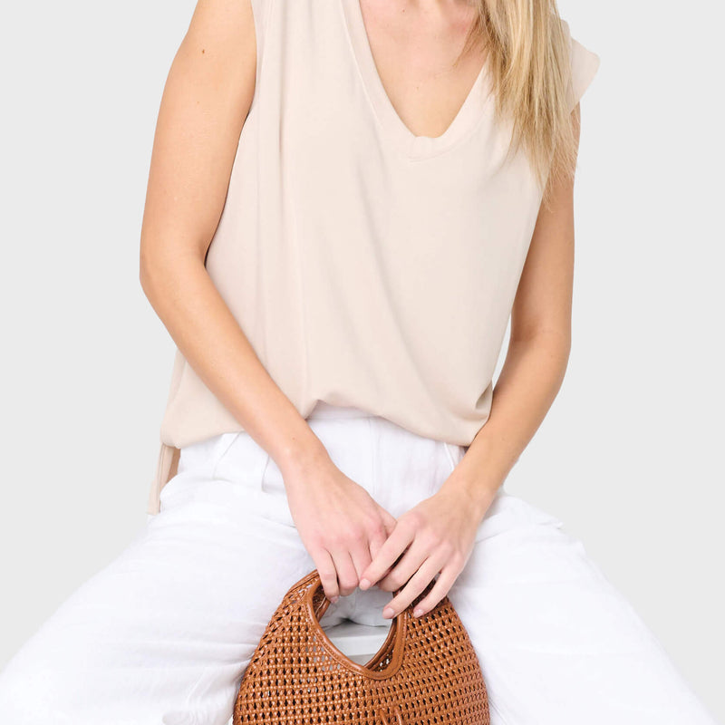 Woman modeling The Favorite Luxe Essentials V-Neck Tee in tan natural styled for everyday, vacation, and weekends
