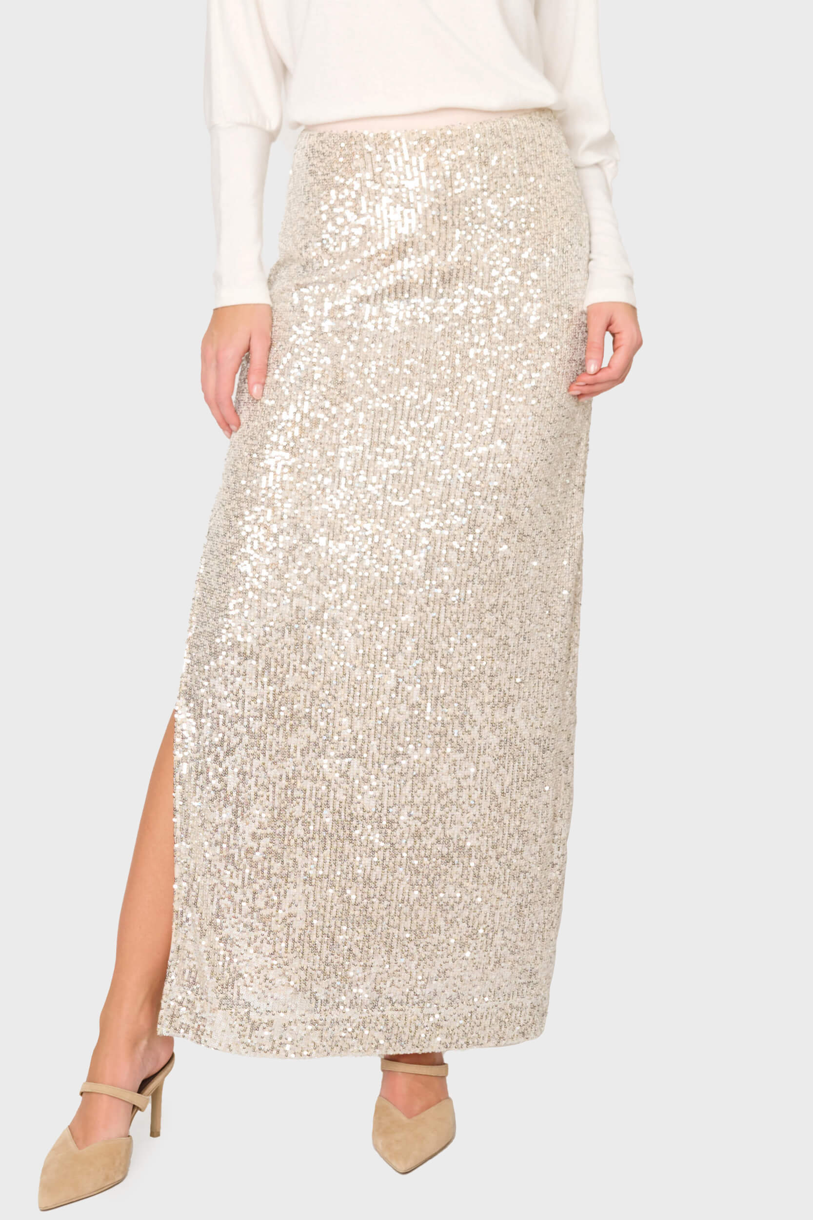 woman modeling Sparkle & Shine Sequin Maxi Skirt in silver styled for nights out, holiday parties