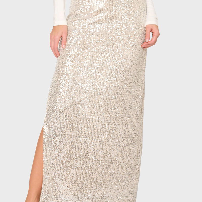 woman modeling Sparkle & Shine Sequin Maxi Skirt in silver styled for nights out, holiday parties
