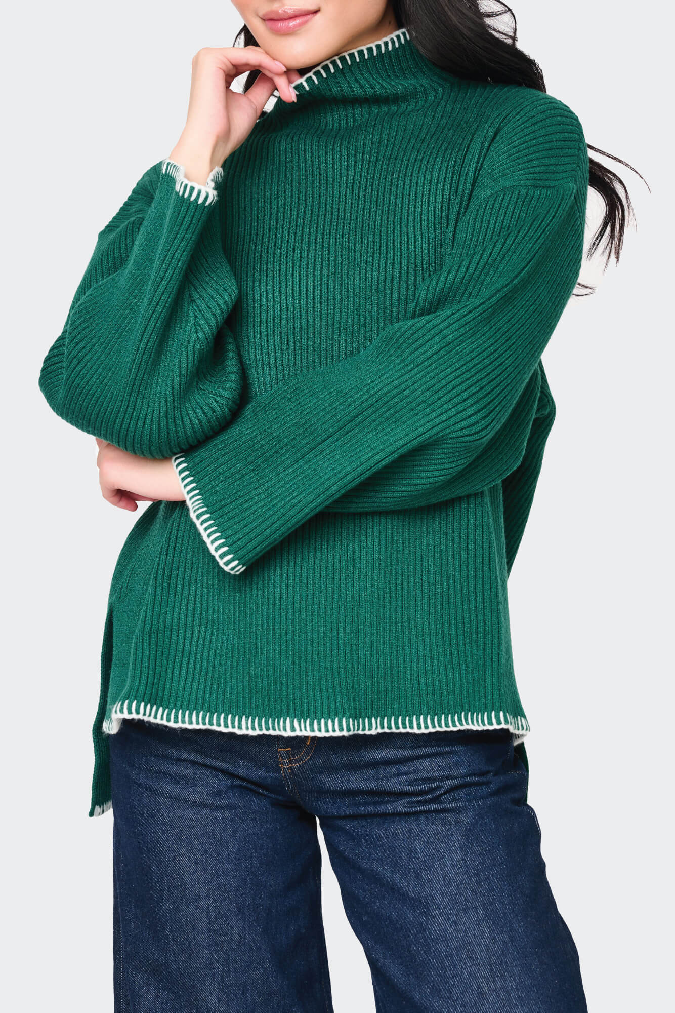 Woman modeling Funnel Neck Whipstitch Tunic Sweater in Green styled for fall holiday events