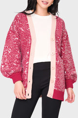 Woman modeling Friday Colorblock Sequin Cardigan in Red Pink styled casual for weekends  