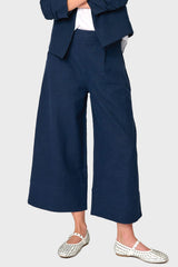 Woman modeling Wide Hem Cropped Linen Pant in navy blue styled as a set for work and everyday