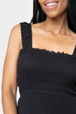 Close-up of women wearing the Reset By Jane Ruffle Tier Midi Dress in black