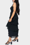 Side of women wearing the Reset By Jane Ruffle Tier Midi Dress in black
