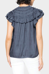 Back of women wearing the Reset By Jane Ruffled Yoke Crinkle Blouse in navy