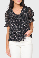 woman modeling Khloe Ruffle Button Down Blouse in black polka dot styled for everyday, work, and nights out