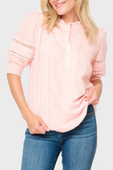 Woman modeling Dianthus Henley Puff Sleeve Pleated Blouse in light Pink Smoke styled business casual 