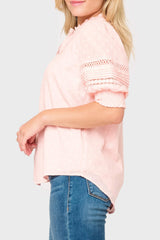 Side of Woman modeling Dianthus Henley Puff Sleeve Pleated Blouse in light Pink Smoke styled business casual 