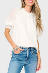 Woman modeling Dianthus Henley Puff Sleeve Pleated Blouse in White styled business casual