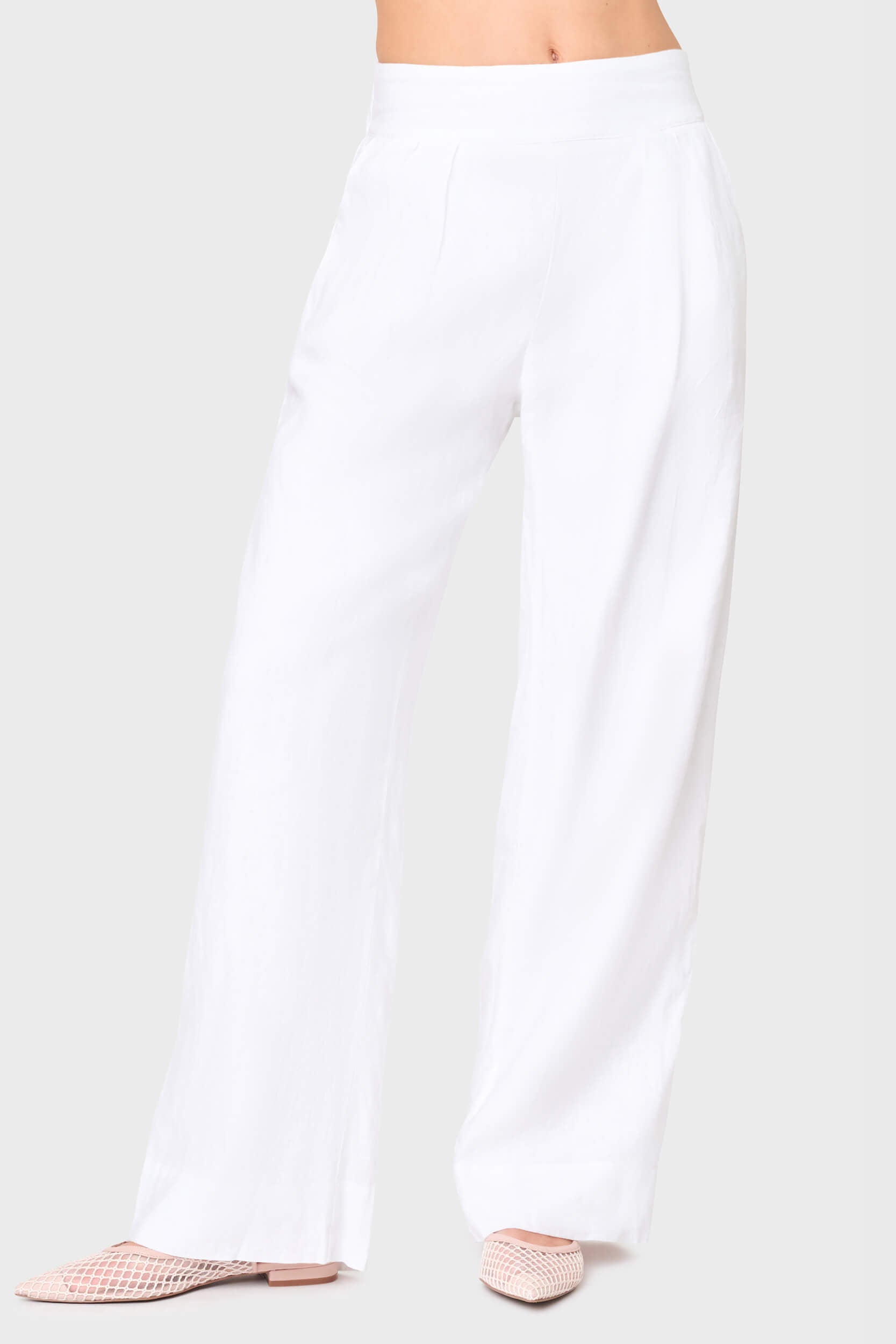 Woman modeling White wide-leg Easy Everyday Linen Pant by Gibsonlook, high-waisted with pleated front