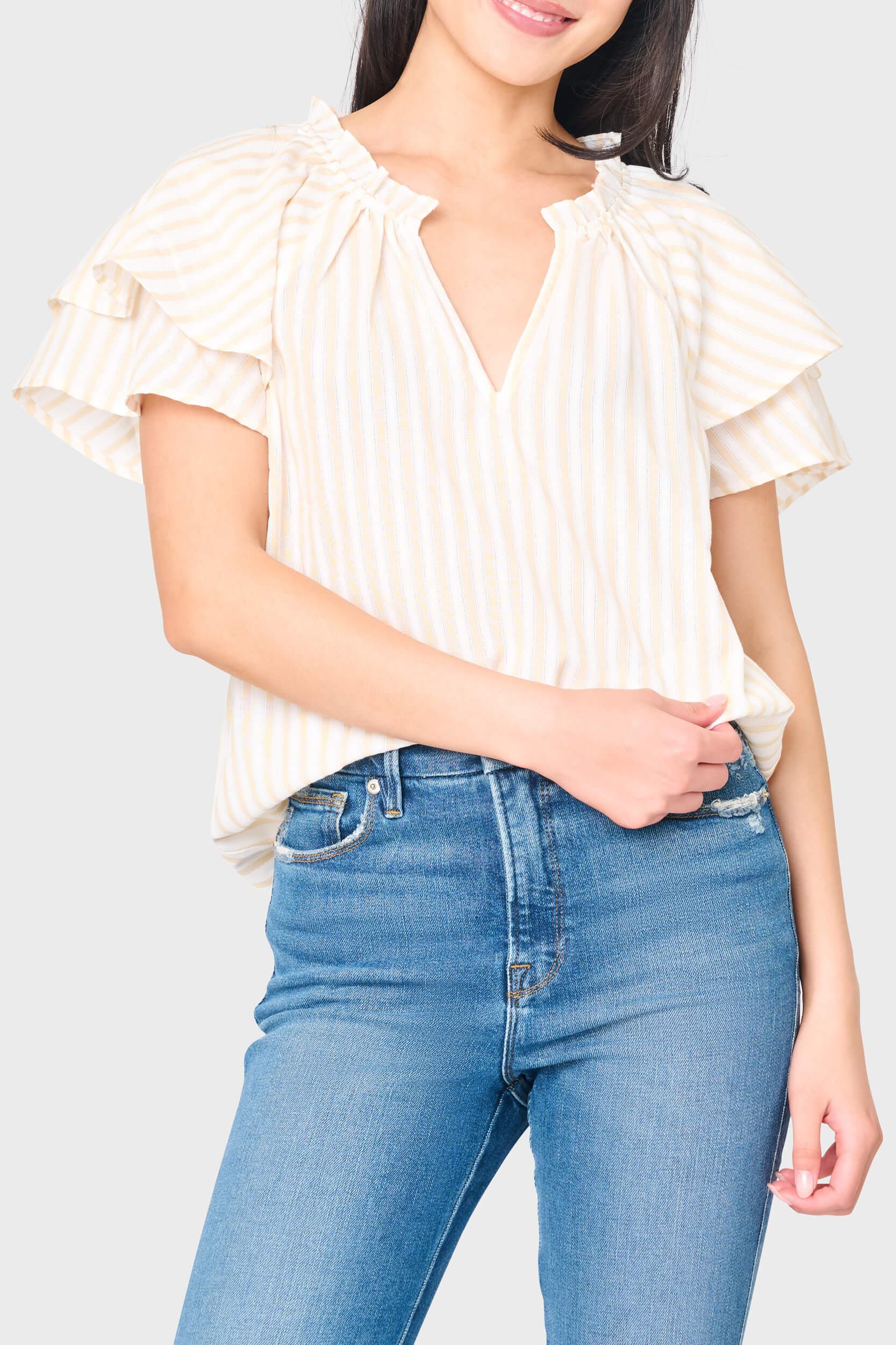 woman modeling Double Flutter On The Daily Top in Tan stripe styled for everyday