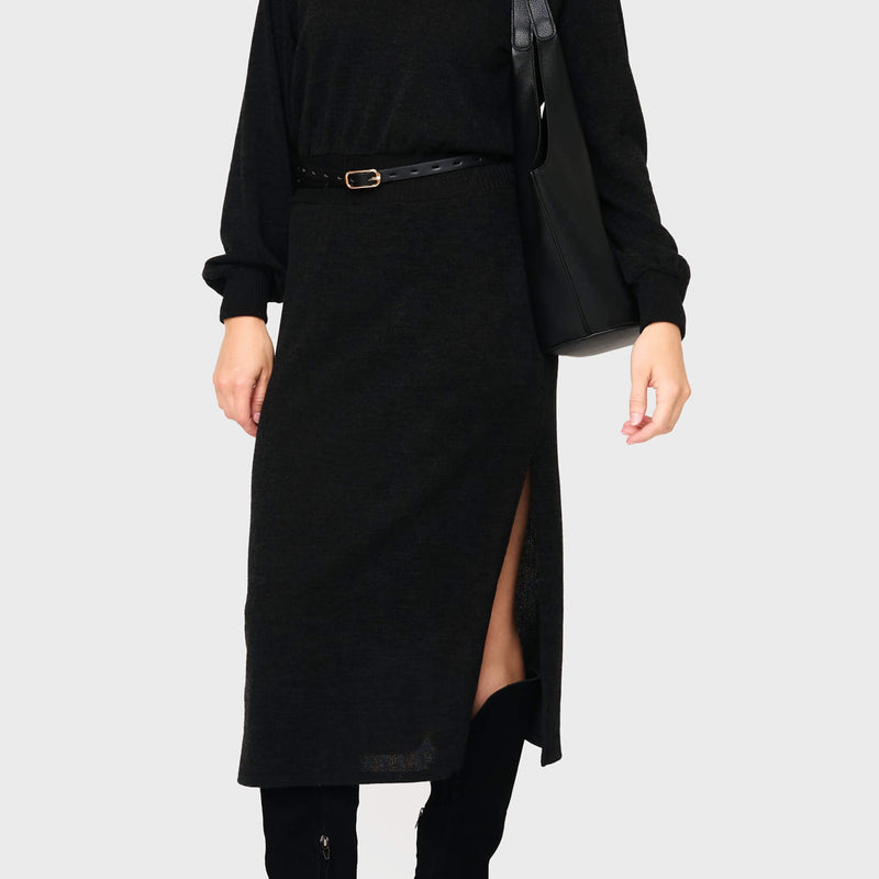 Woman modeling Long Sleeve V-Neck Midi Sweater Dress in Black styled business casual for work