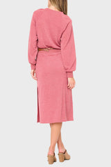 Back of Woman modeling Long Sleeve V-Neck Midi Sweater Dress in light mauve red styled for work business casual