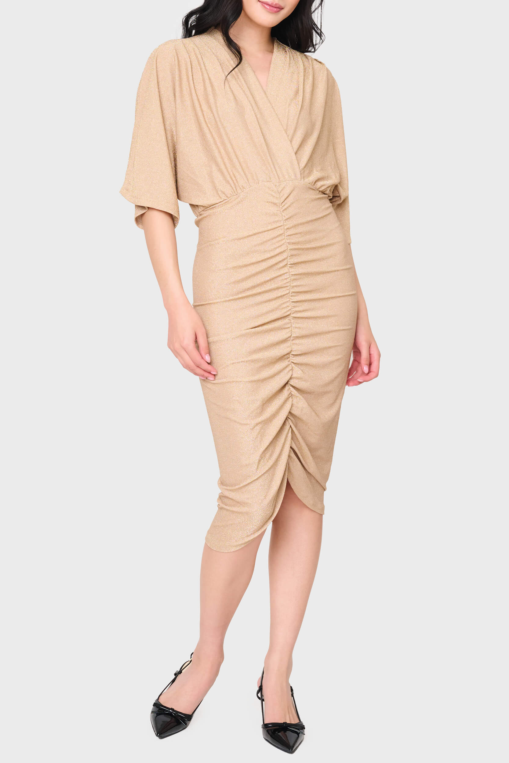 Woman modeling Knit Cinch Surplice Midi Dress in Champagne beige lurex sparkle styled for holiday parties