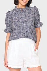 Woman modeling Dianthus Henley Puff Sleeve Blouse in Midnight Vine navy styled for work to weekend to vacation