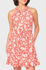 Woman modeling Khloe Ruffle Halter Dress in Desert Rose Garden print styled for nights out and vacations