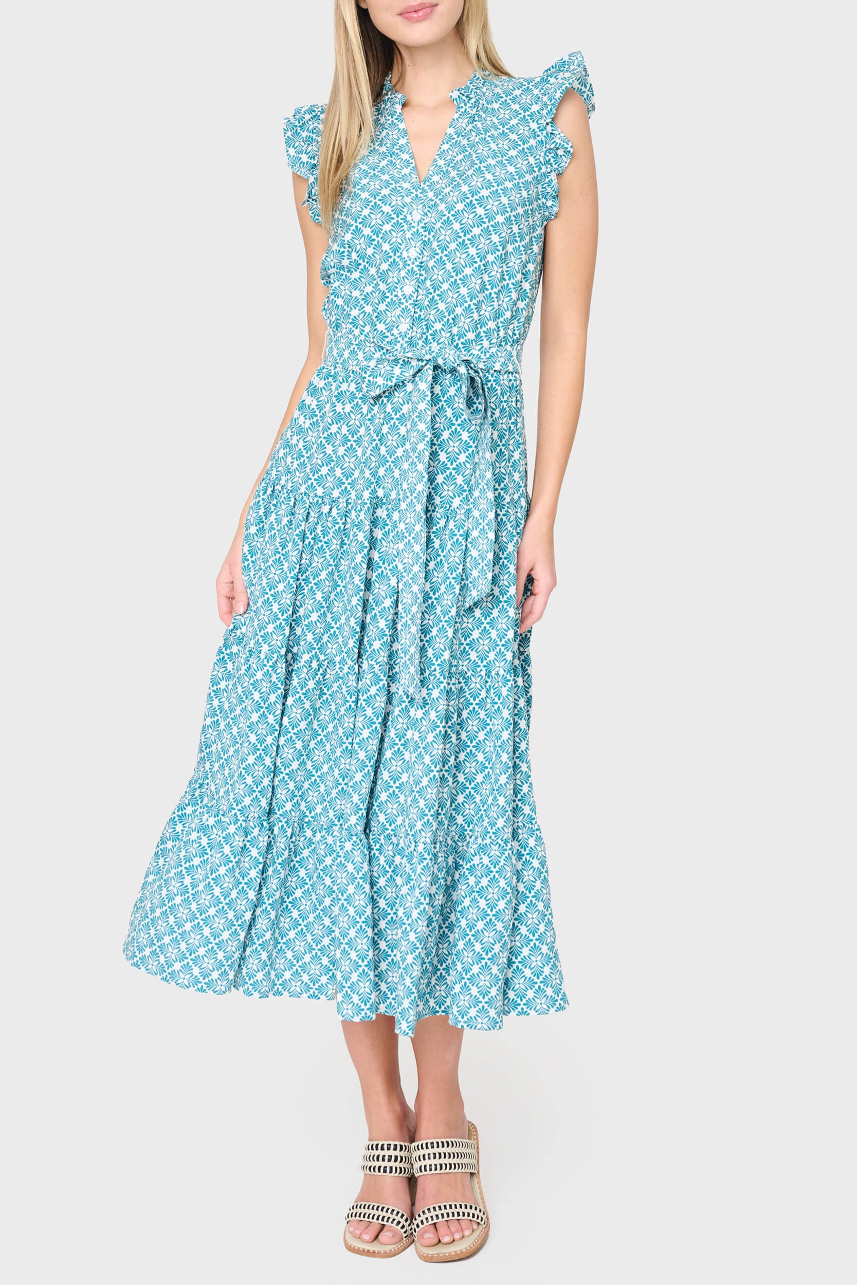 woman modeling Dianthus Maxi Dress in teal leaf tile styled for work and weekends