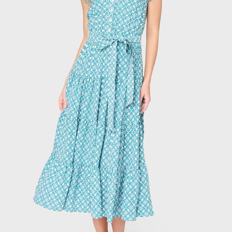 woman modeling Dianthus Maxi Dress in teal leaf tile styled for work and weekends