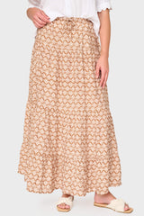 Woman modeling Tiered Ultra Maxi Skirt in Mocha shell brown print styled for vacations, work, and weekends