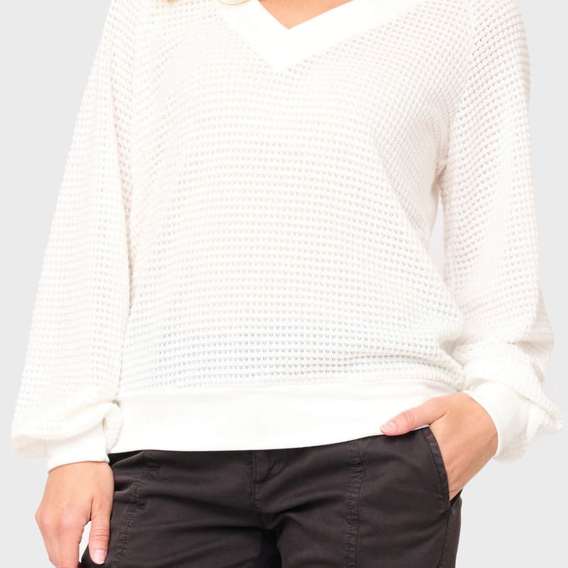 Woman modeling Courtside Open Weave Sweater in White styled for a casual weekend