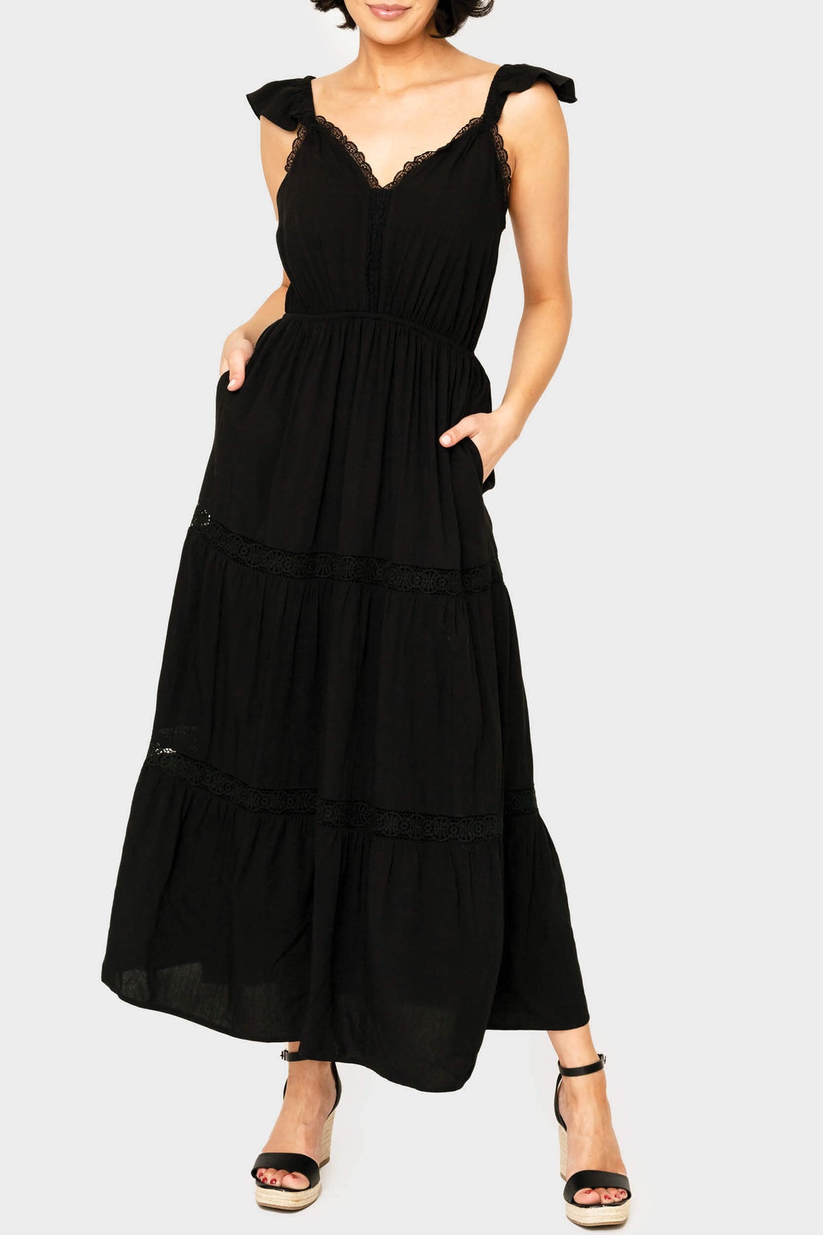 Front of women wearing the Strappy Crochet Inset Maxi Dress in black