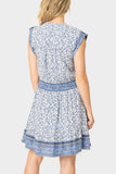 Back of women wearing the Lindsey Border Dress in navy white print