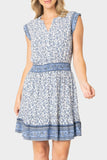 Front of women wearing the Lindsey Border Dress in navy white print 
