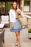 Front of women wearing the Lindsey Border Dress in navy white print