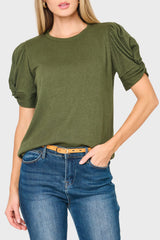 Woman modeling Twist Sleeve Luxe Tee in Olive green styled for work, date night, and everyday