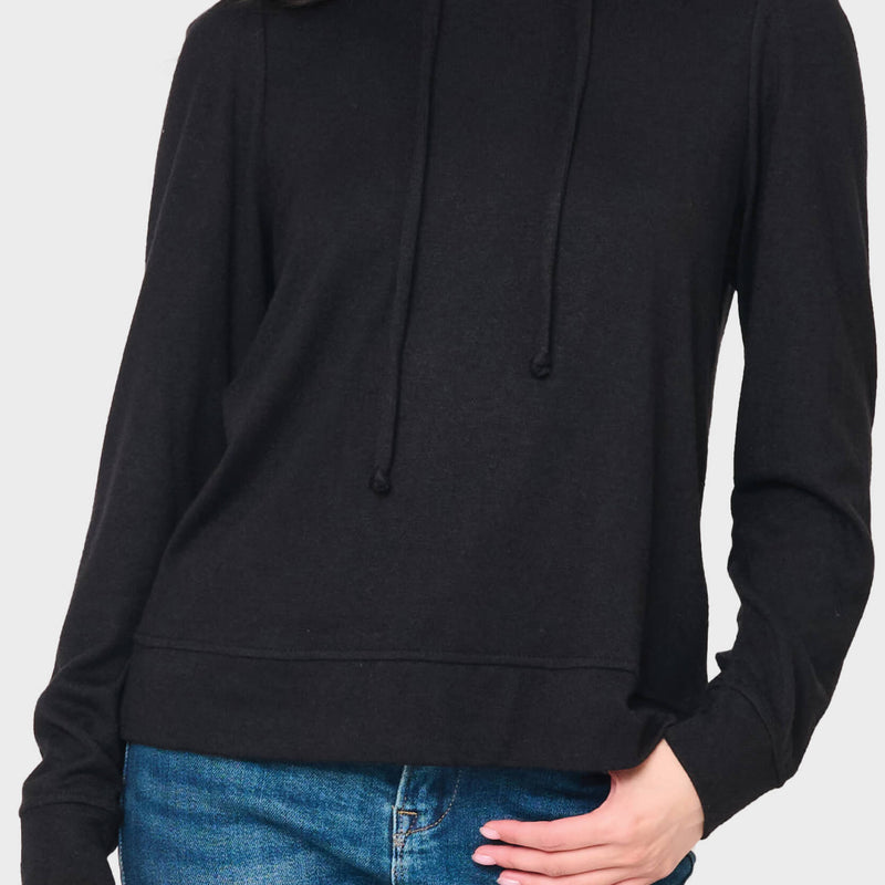 Woman modeling The Chic Luxe Alpine Hoodie in black styled casual for weekends and lounge